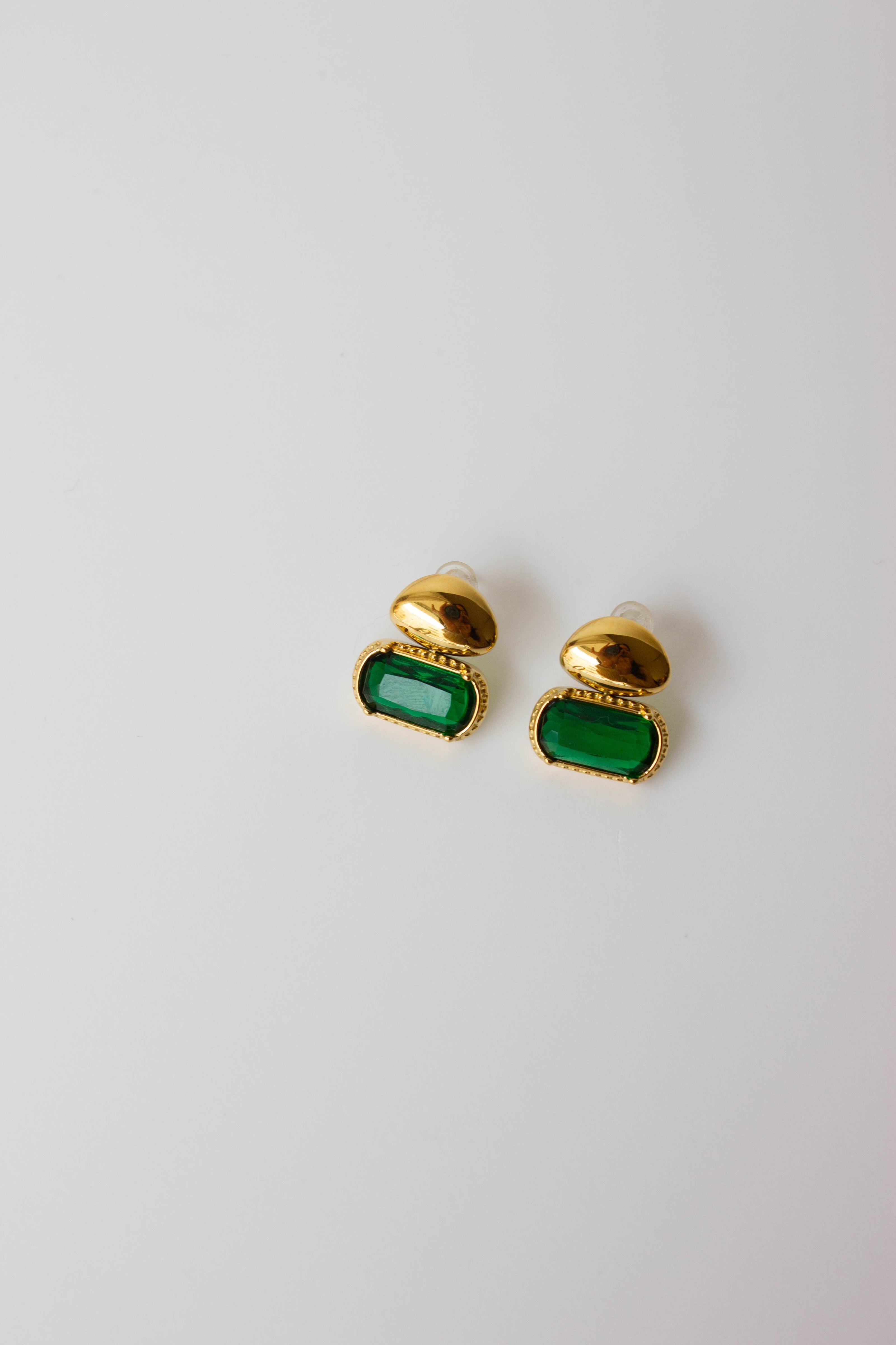 Gold-plated steel earrings with a green stone.