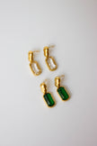 Gold-plated steel earrings with green or clear stone.