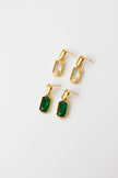 Gold-plated steel earrings with green or clear stone.