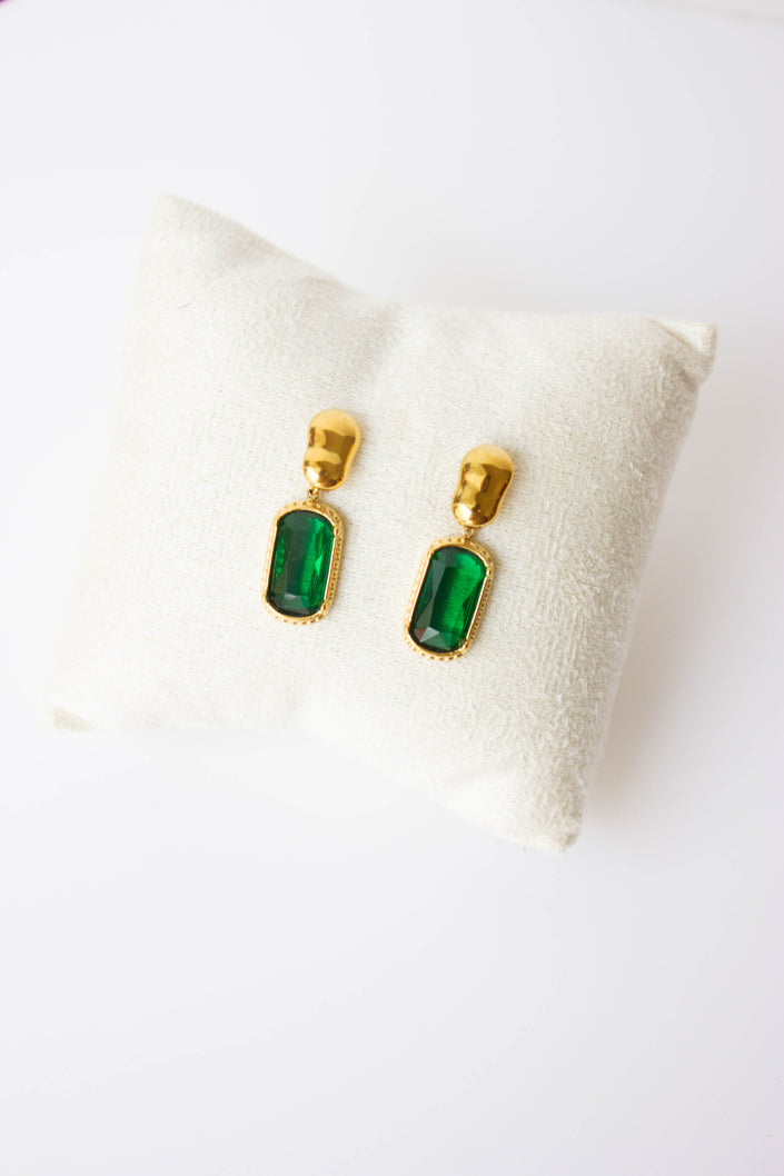Gold-plated steel earrings with green or clear stone.