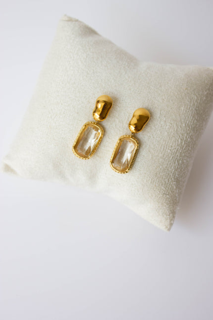Gold-plated steel earrings with green or clear stone.
