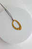 Colar Ajustável Castanho com Pendente Oval em Aço