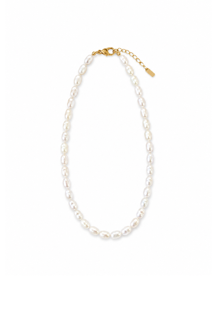 Short gold-tone steel necklace with irregular freshwater pearls.