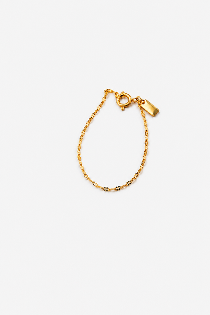 Primeira fotografia da pulseira dourada Pulseira em Aço Dourada Minimalista Torcida