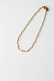 Pulseira de Pé em Aço com Bolinhas Brancas