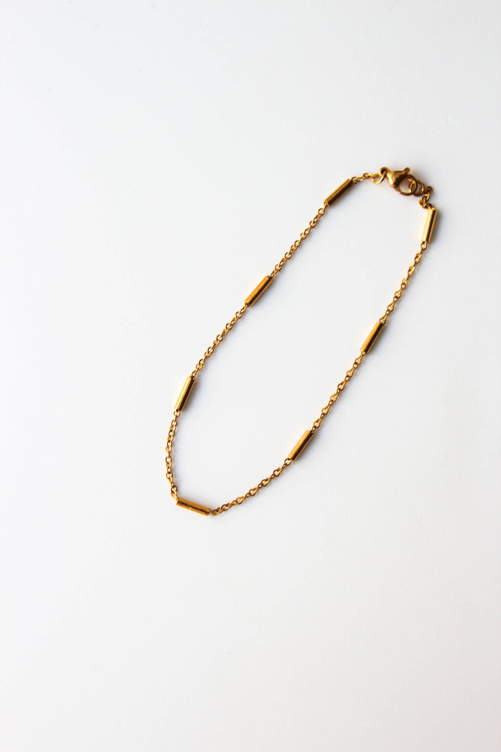 Pulseira de Pé em Aço com Cilindros