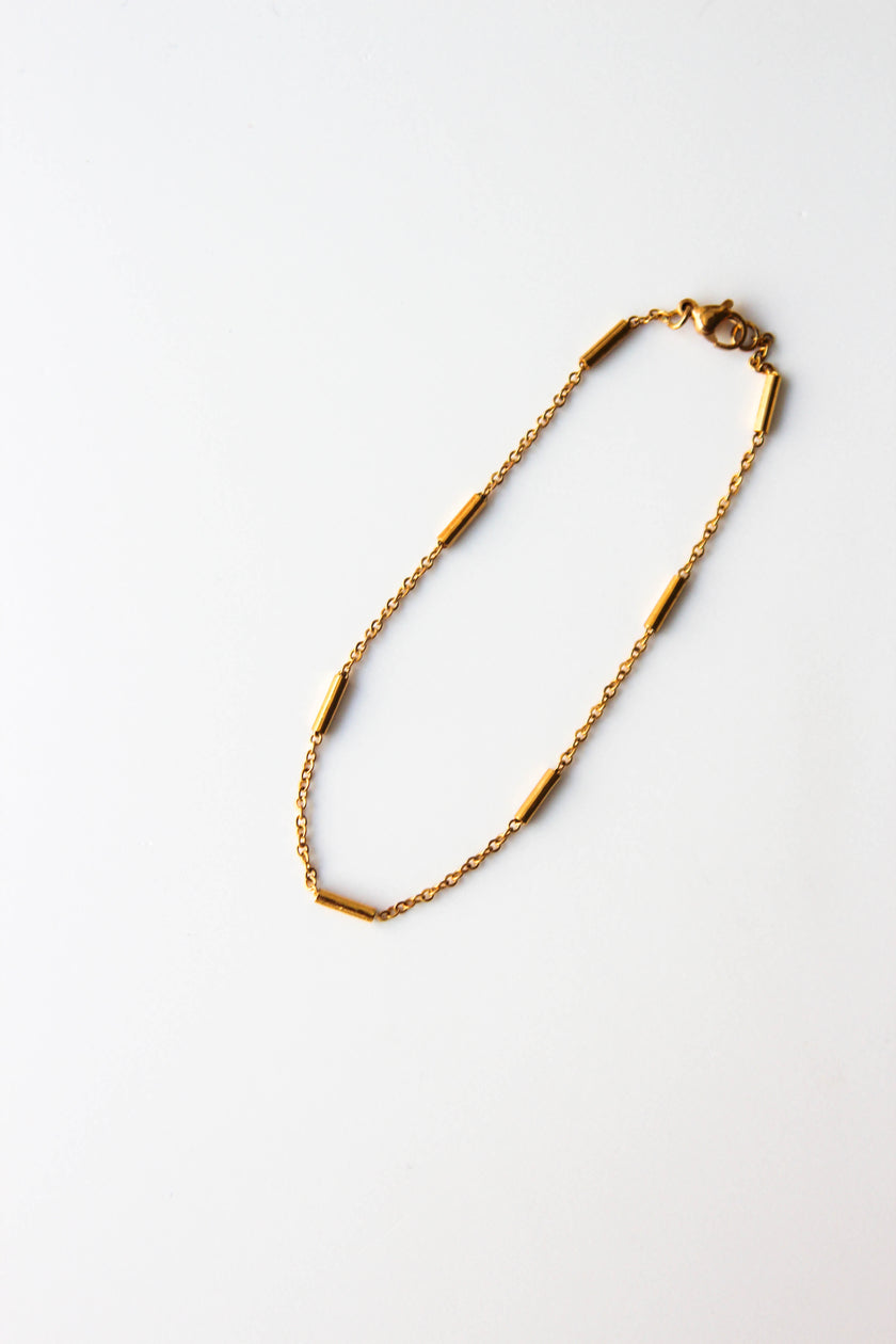 Pulseira de Pé em Aço com Cilindros