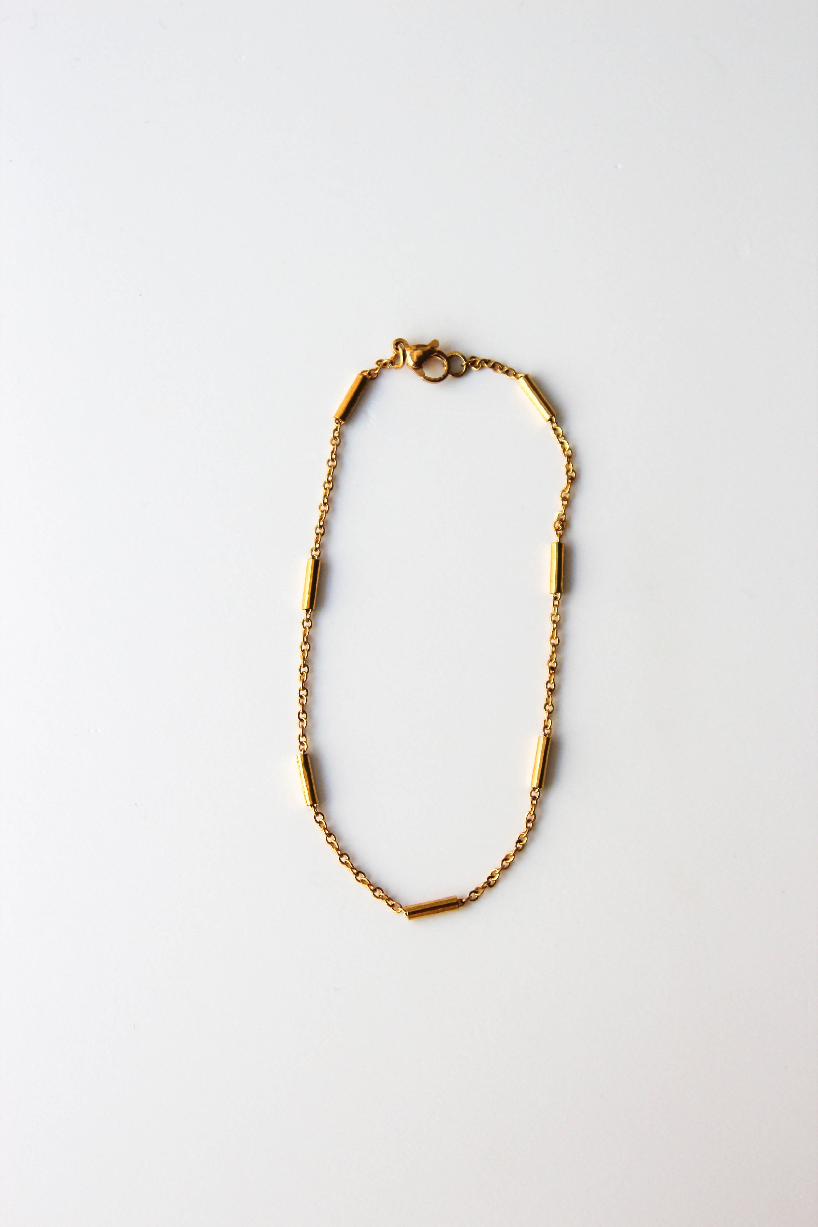Pulseira de Pé em Aço com Cilindros