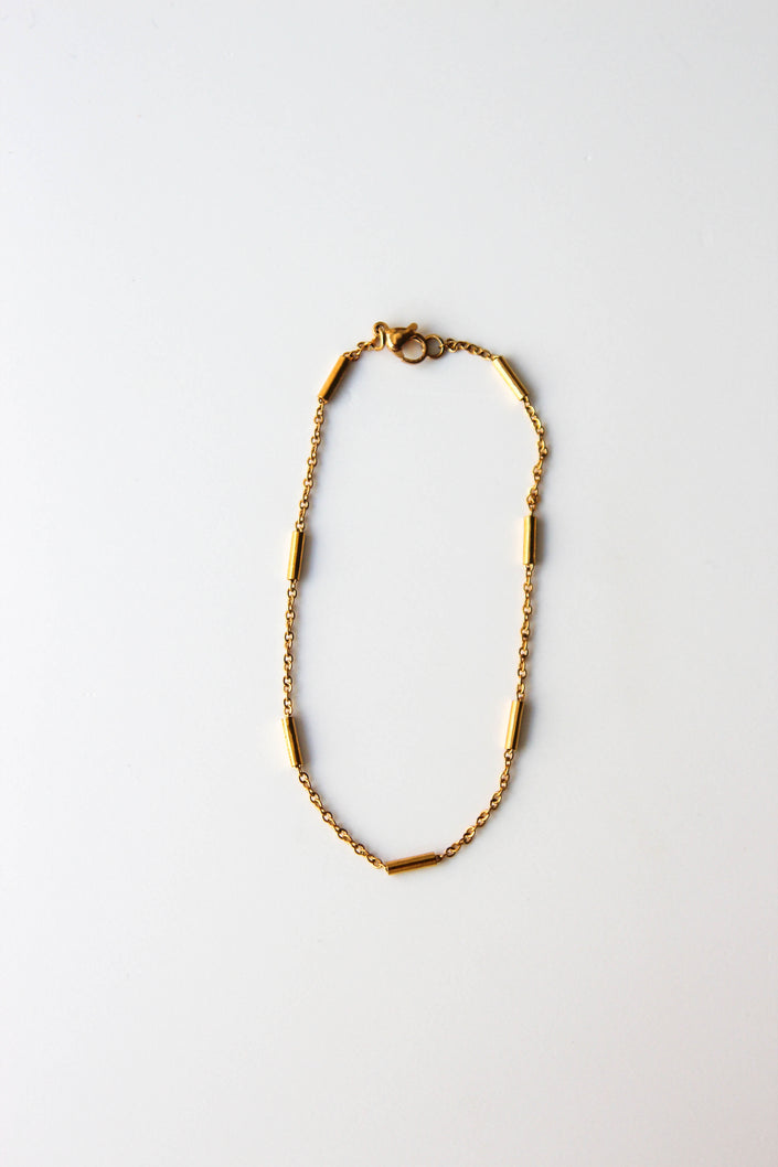 Pulseira de Pé em Aço com Cilindros