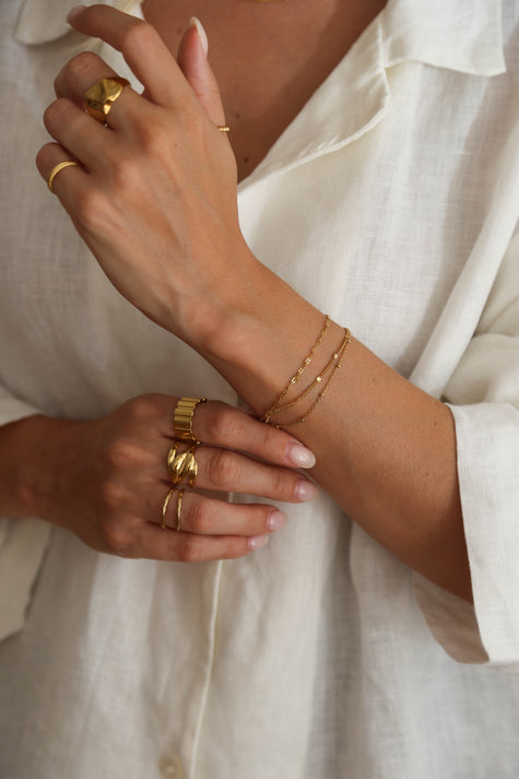 Anel em Aço Duplo Entrelaçado Dourado ou Prateado